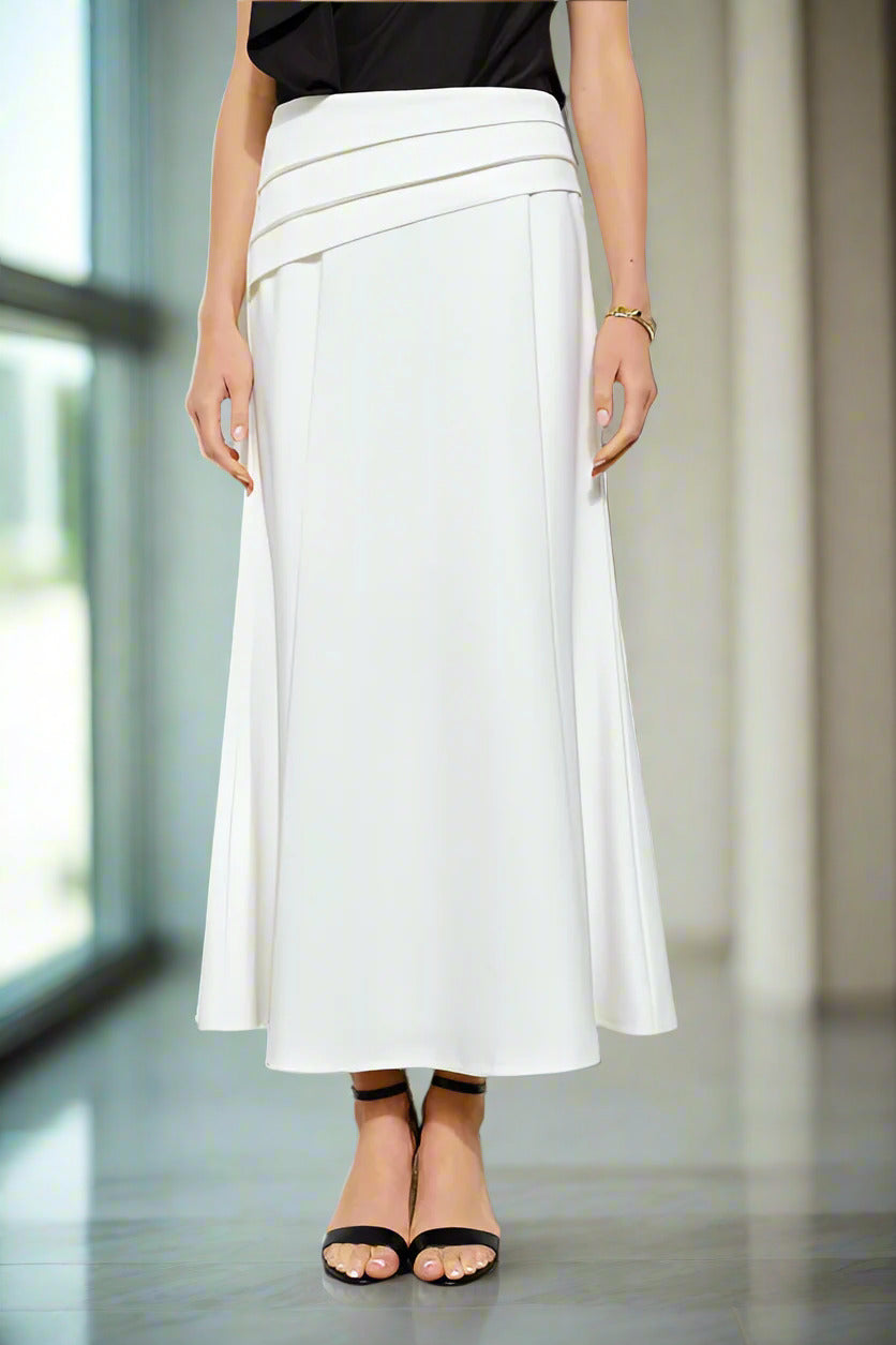 White skirt worn by a person on a white background